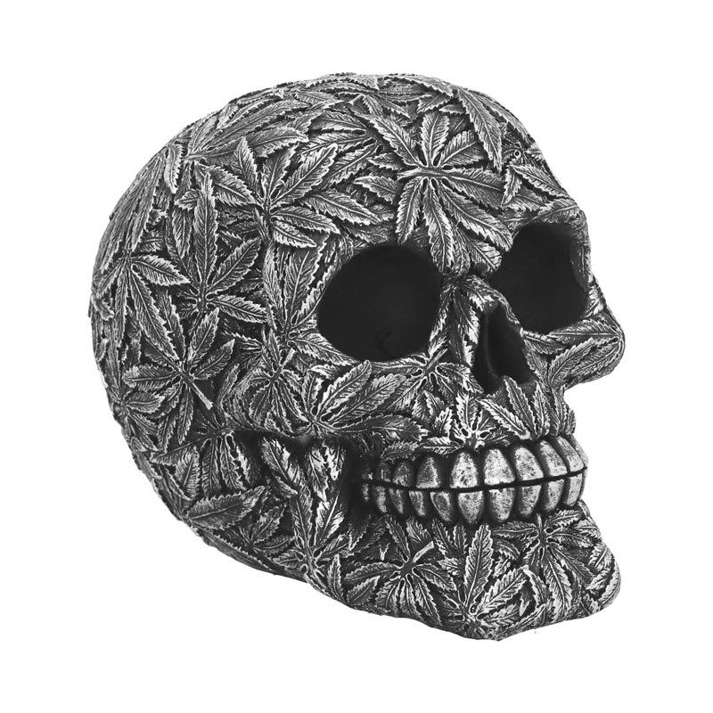 Teschio silvermarj da collezione - soprammobile ornamentale umoristico a forma di cranio umano decorato con foglie di marijana argentate.