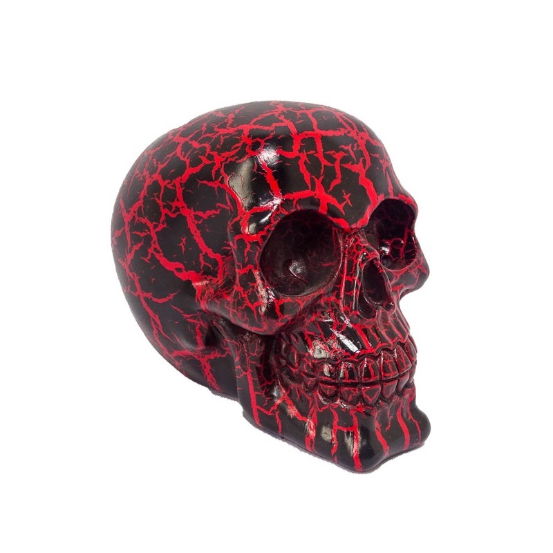 Teschio red fracture da collezione - soprammobile ornamentale umoristico a forma di cranio umano nero con spaccature rosse.